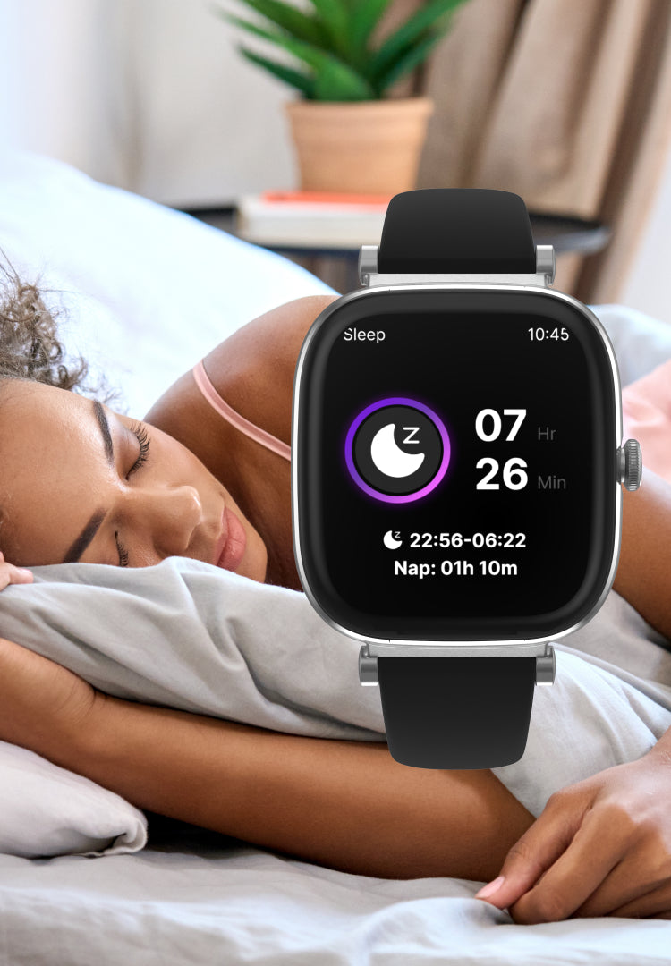 Person lying in bed with a smartwatch displaying sleep tracking information.